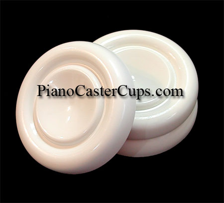 White piano caster cups